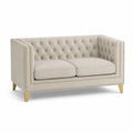 Divano in velluto beige con gambe in legno