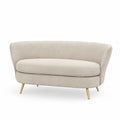 Divano in tessuto beige con gambe in metallo
